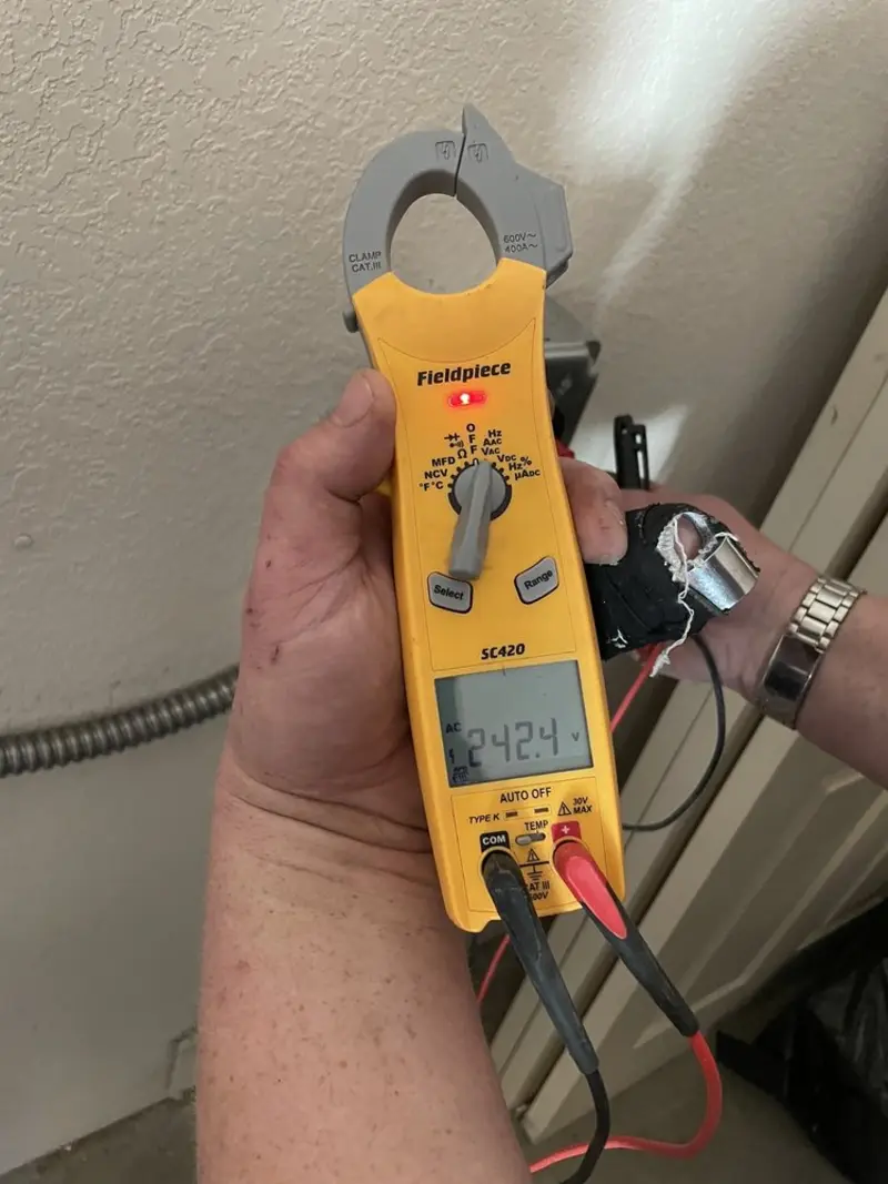 Voltage testing with clamp meter during Recessed Lighting Installation in Collingdale